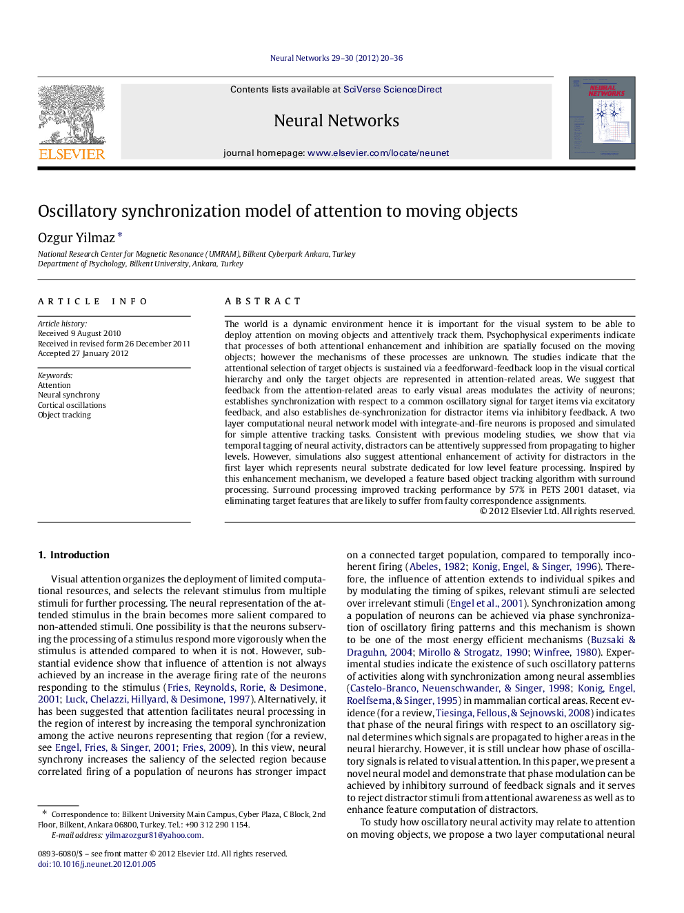 Oscillatory synchronization model of attention to moving objects