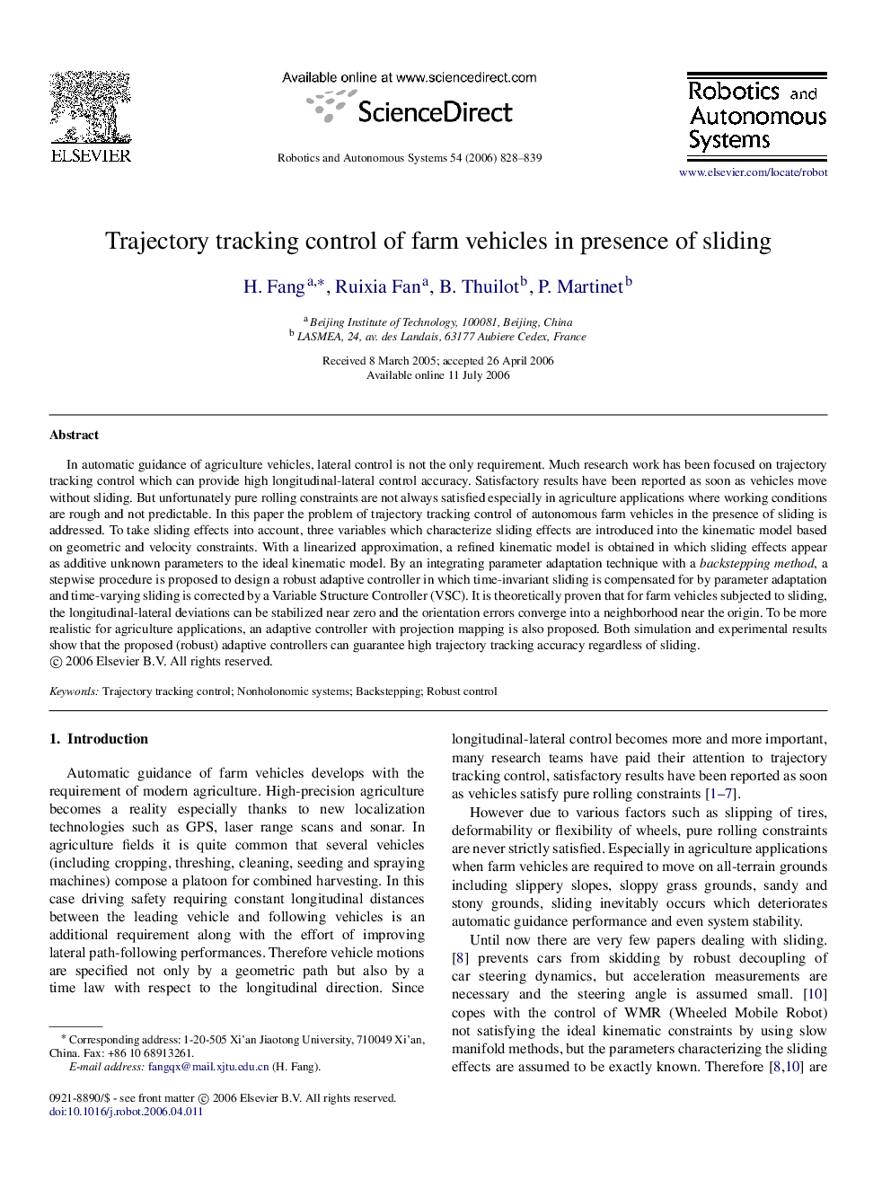 Trajectory tracking control of farm vehicles in presence of sliding