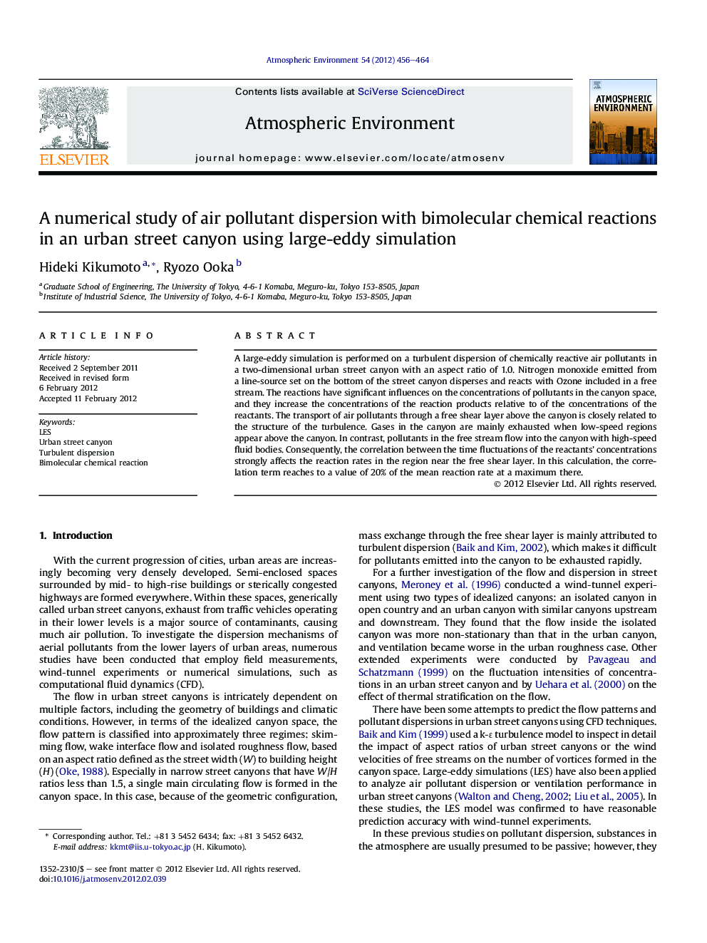 A numerical study of air pollutant dispersion with bimolecular chemical reactions in an urban street canyon using large-eddy simulation