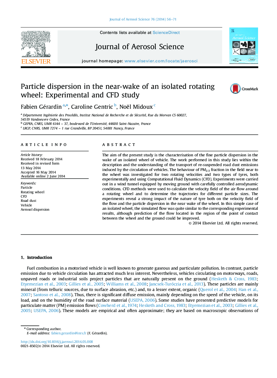 Particle dispersion in the near-wake of an isolated rotating wheel: Experimental and CFD study