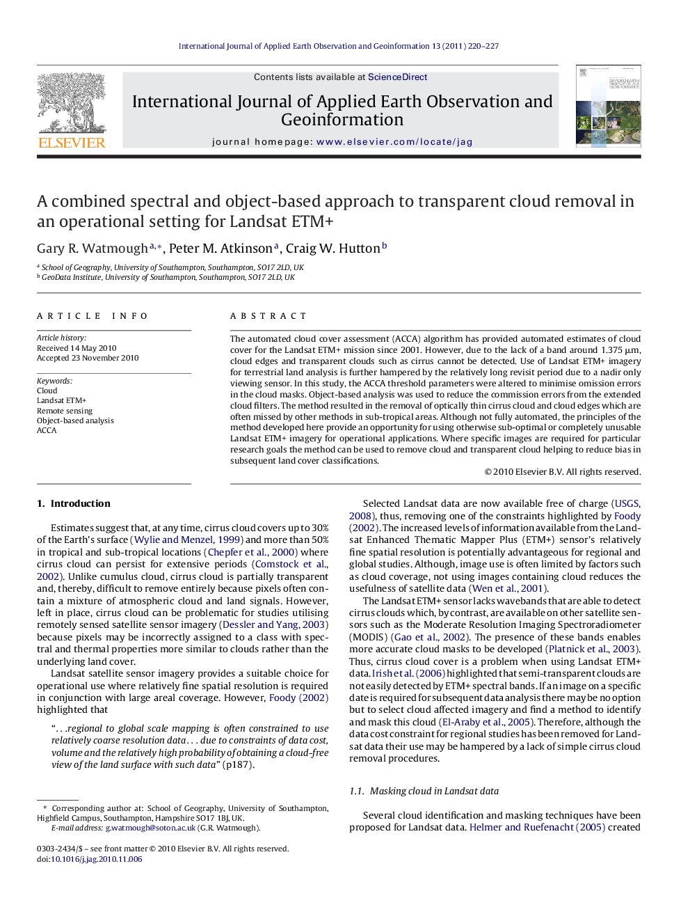 A combined spectral and object-based approach to transparent cloud removal in an operational setting for Landsat ETM+