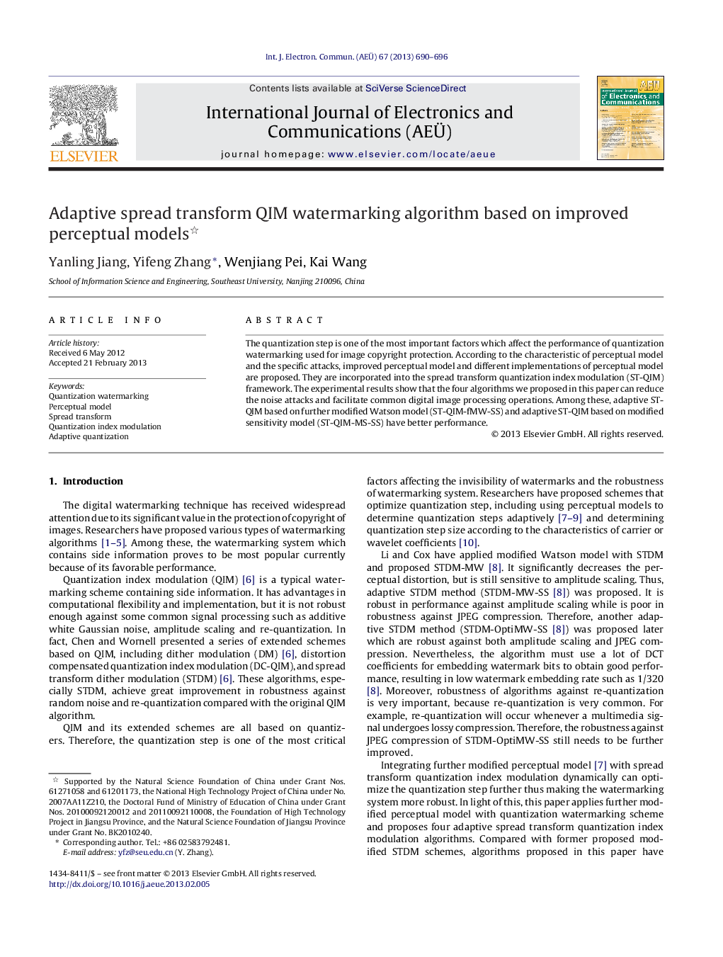 Adaptive spread transform QIM watermarking algorithm based on improved perceptual models 