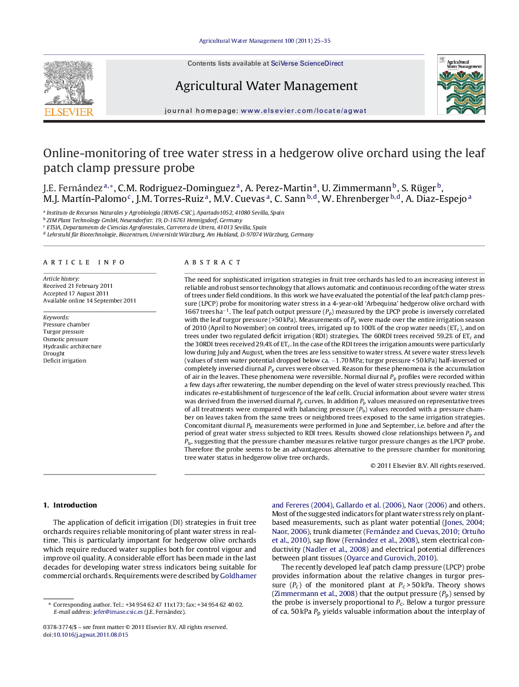 Online-monitoring of tree water stress in a hedgerow olive orchard using the leaf patch clamp pressure probe