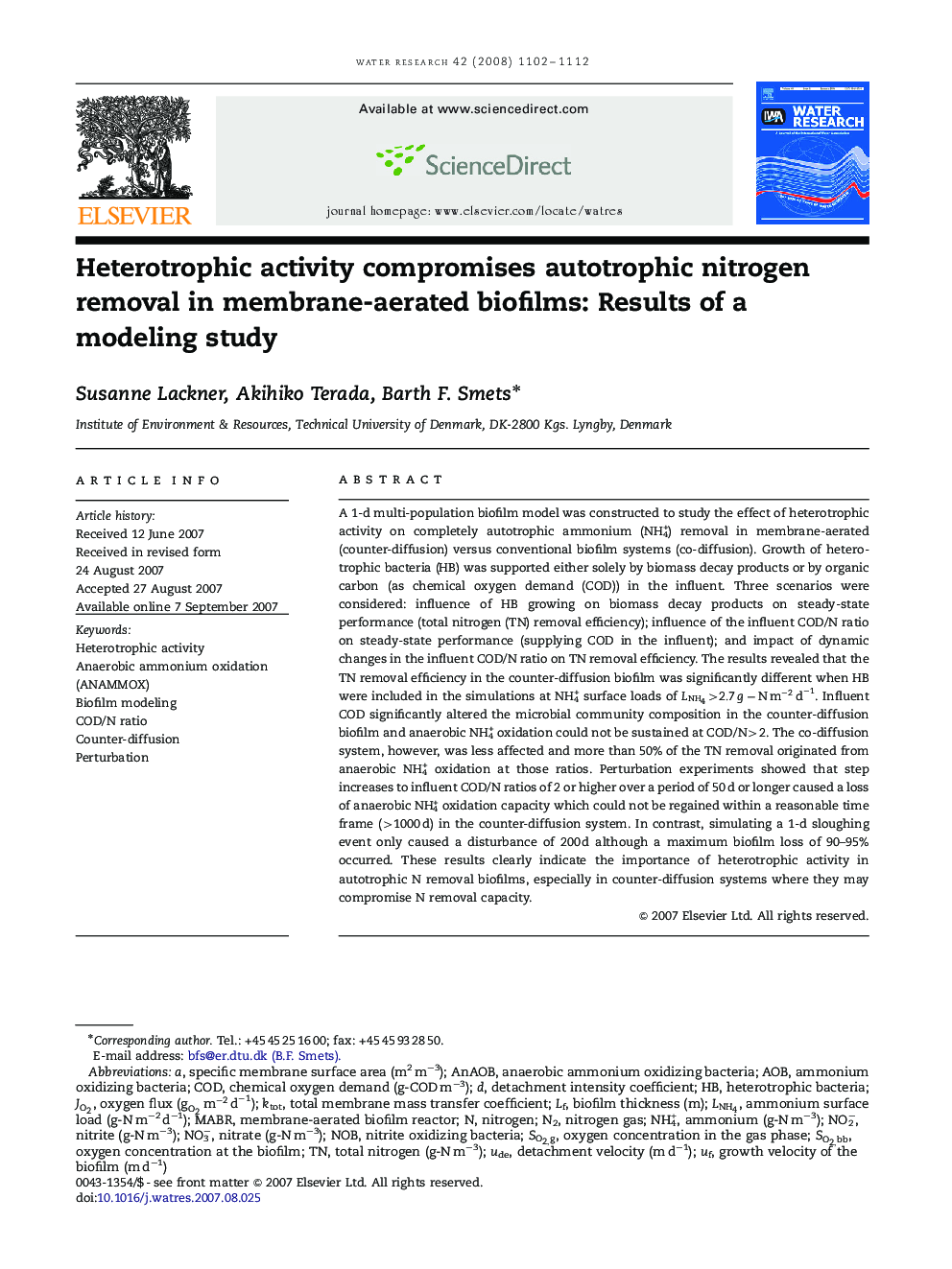 Heterotrophic activity compromises autotrophic nitrogen removal in membrane-aerated biofilms: Results of a modeling study