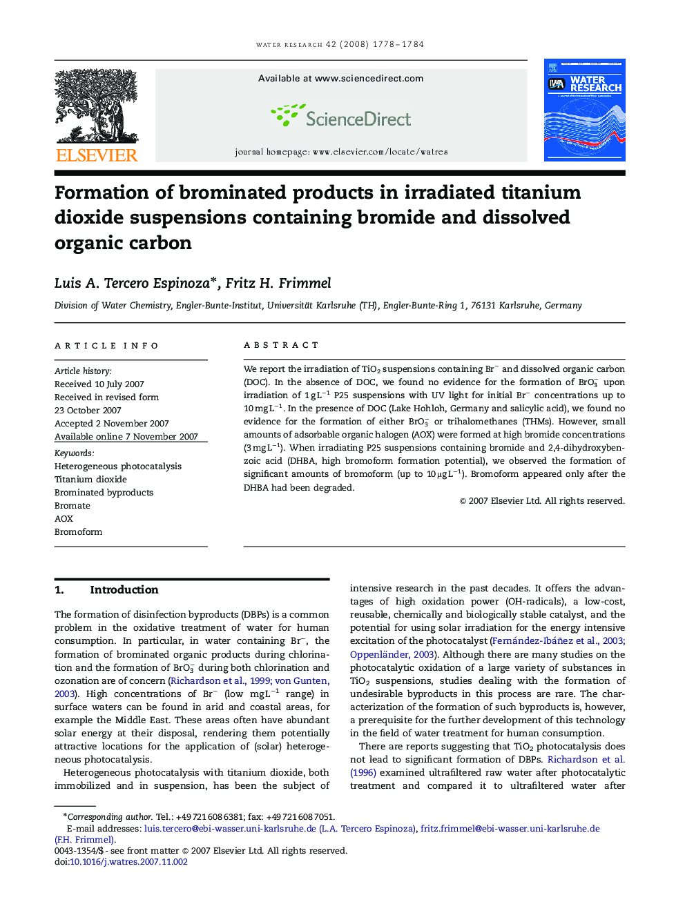 Formation of brominated products in irradiated titanium dioxide suspensions containing bromide and dissolved organic carbon