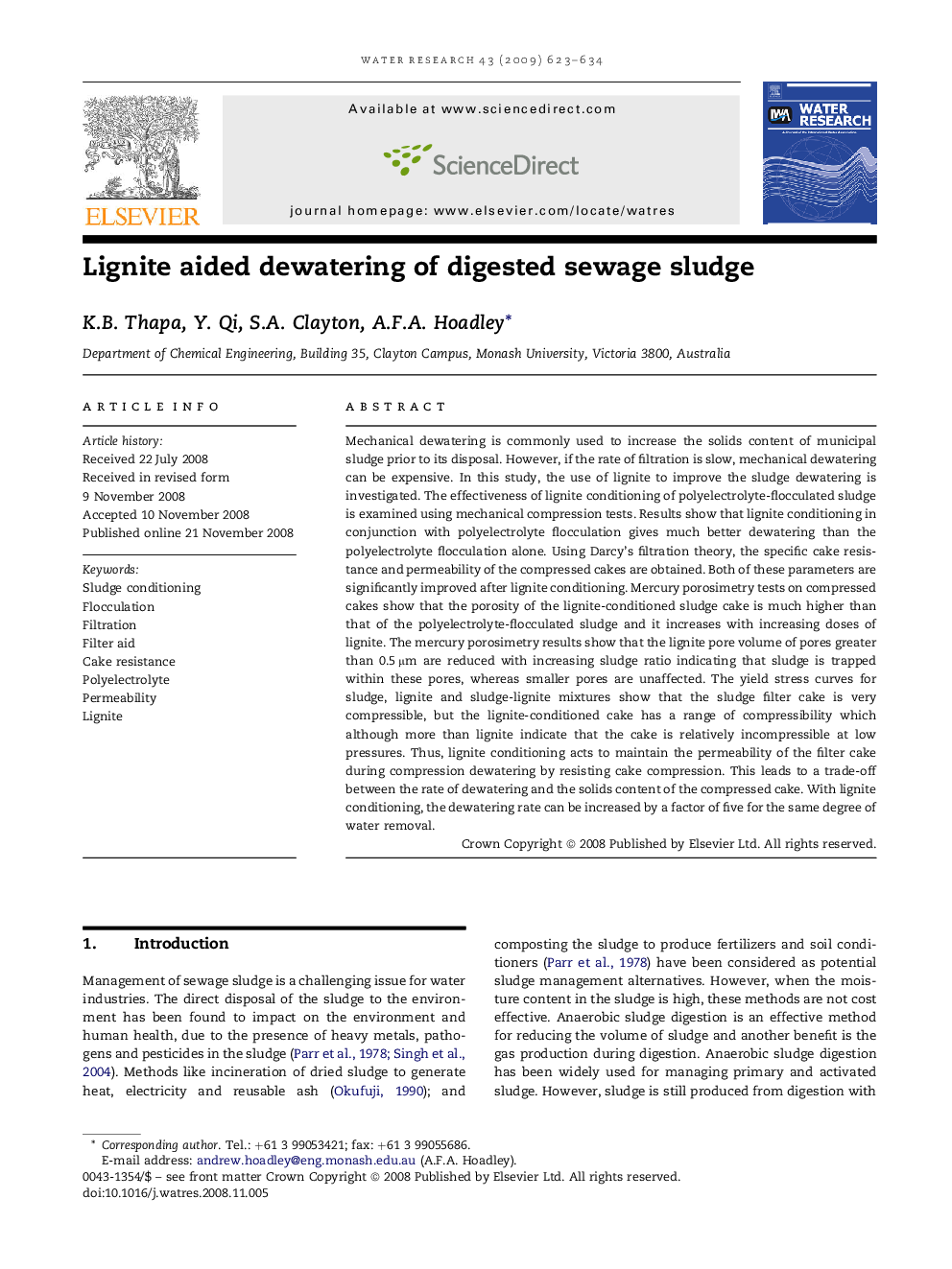 Lignite aided dewatering of digested sewage sludge