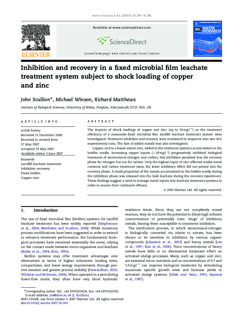 Inhibition and recovery in a fixed microbial film leachate treatment system subject to shock loading of copper and zinc