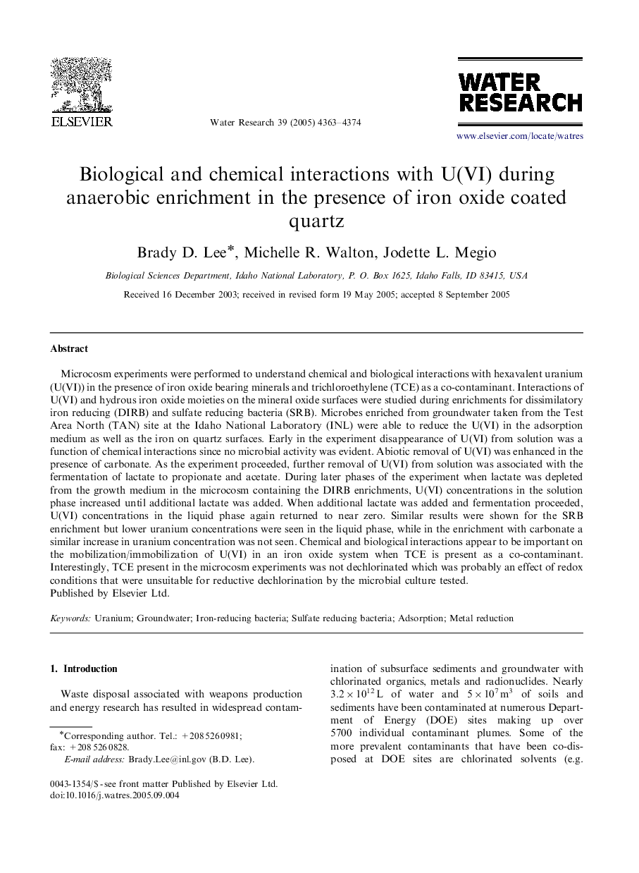 Biological and chemical interactions with U(VI) during anaerobic enrichment in the presence of iron oxide coated quartz