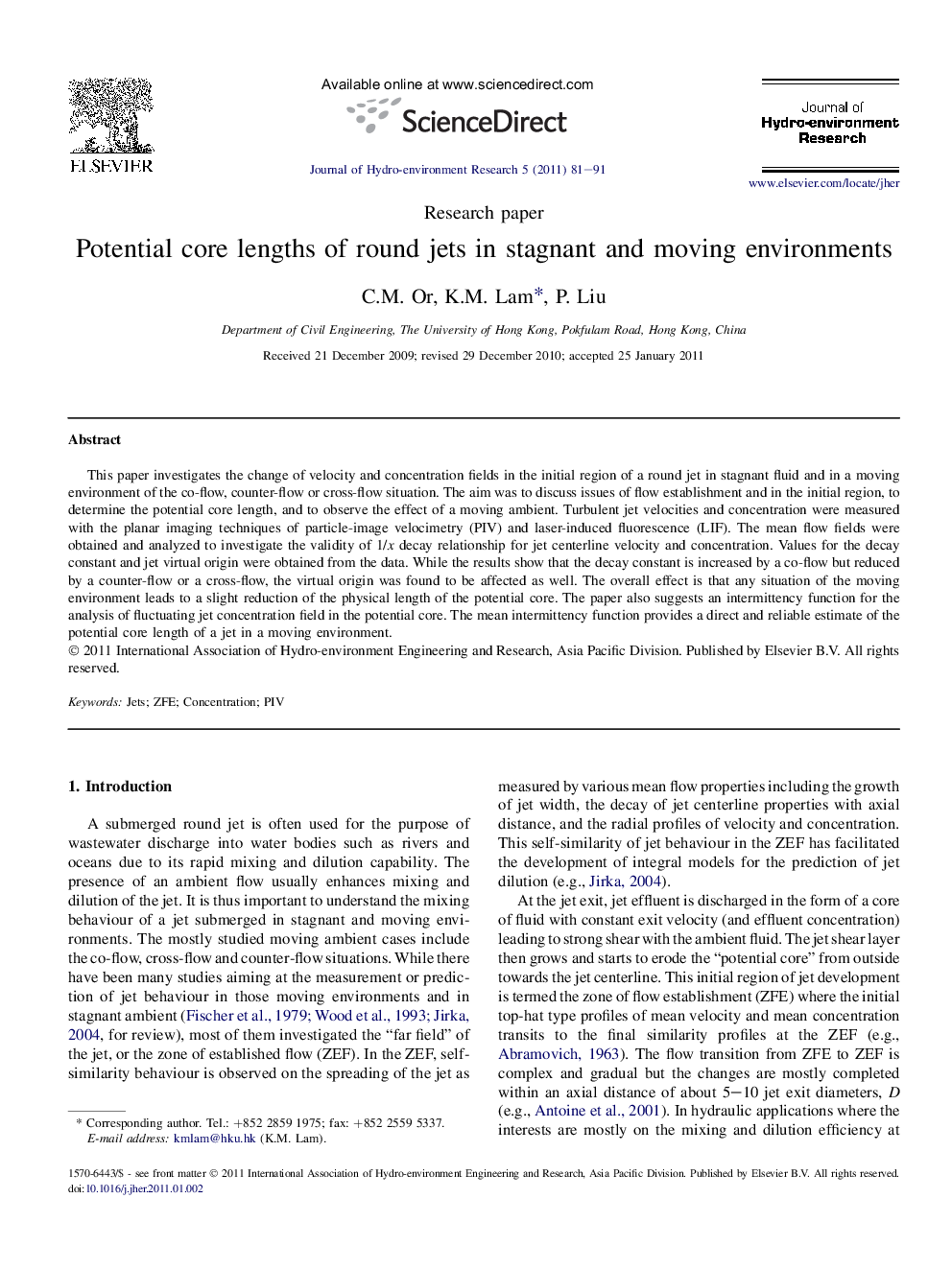 Potential core lengths of round jets in stagnant and moving environments