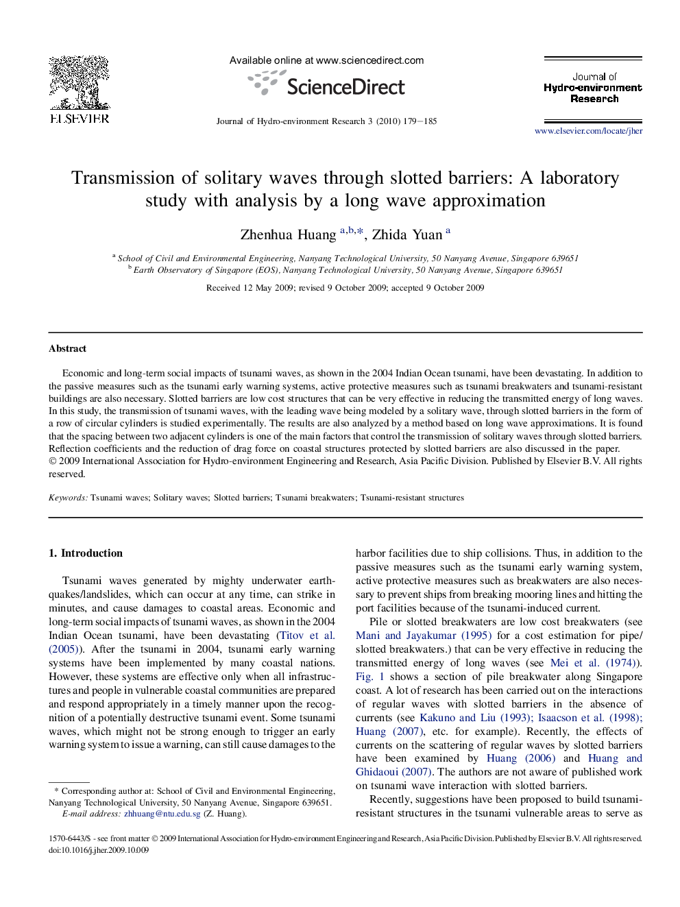 Transmission of solitary waves through slotted barriers: A laboratory study with analysis by a long wave approximation