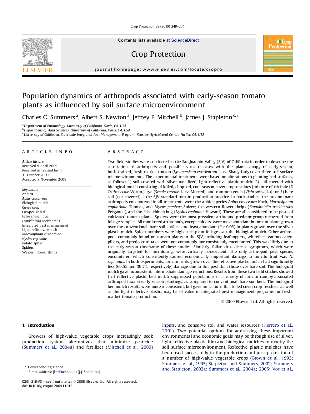 Population dynamics of arthropods associated with early-season tomato plants as influenced by soil surface microenvironment