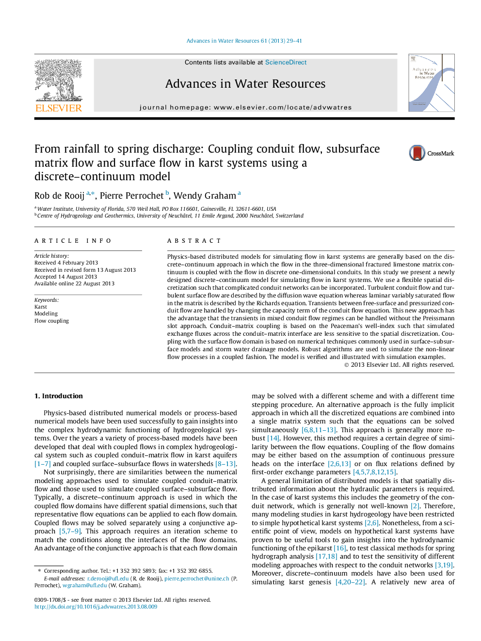 From rainfall to spring discharge: Coupling conduit flow, subsurface matrix flow and surface flow in karst systems using a discrete–continuum model