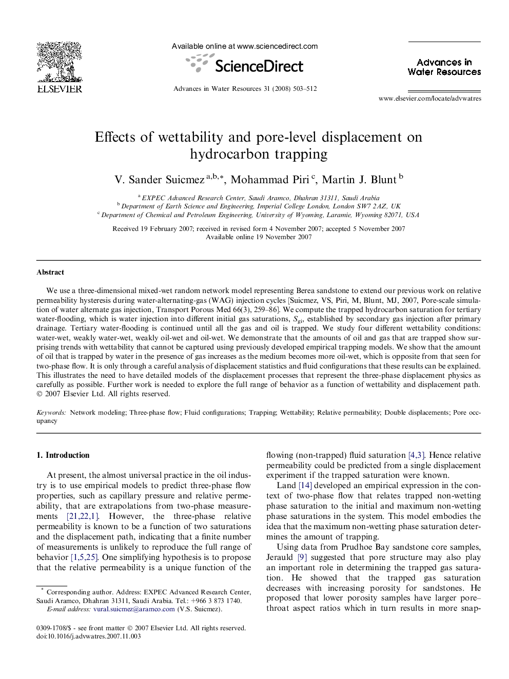 Effects of wettability and pore-level displacement on hydrocarbon trapping