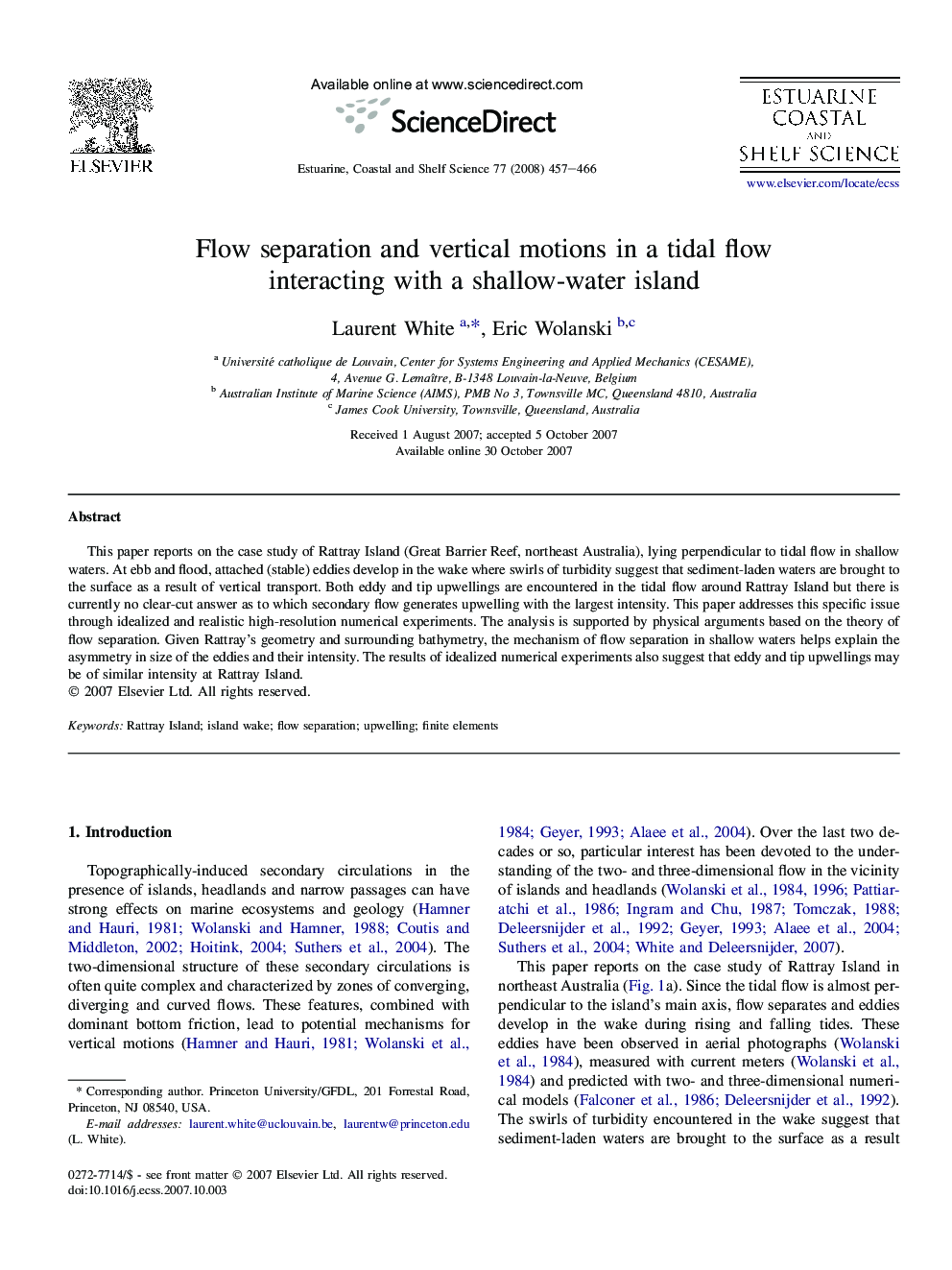 Flow separation and vertical motions in a tidal flow interacting with a shallow-water island