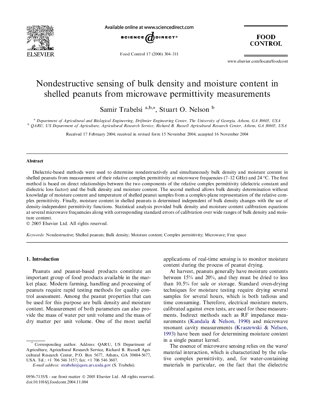 Nondestructive sensing of bulk density and moisture content in shelled peanuts from microwave permittivity measurements