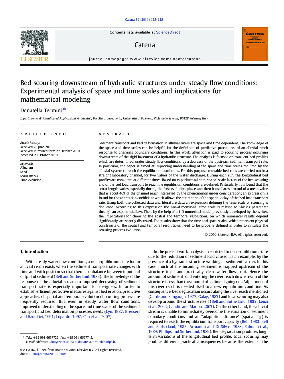 Bed scouring downstream of hydraulic structures under steady flow conditions: Experimental analysis of space and time scales and implications for mathematical modeling