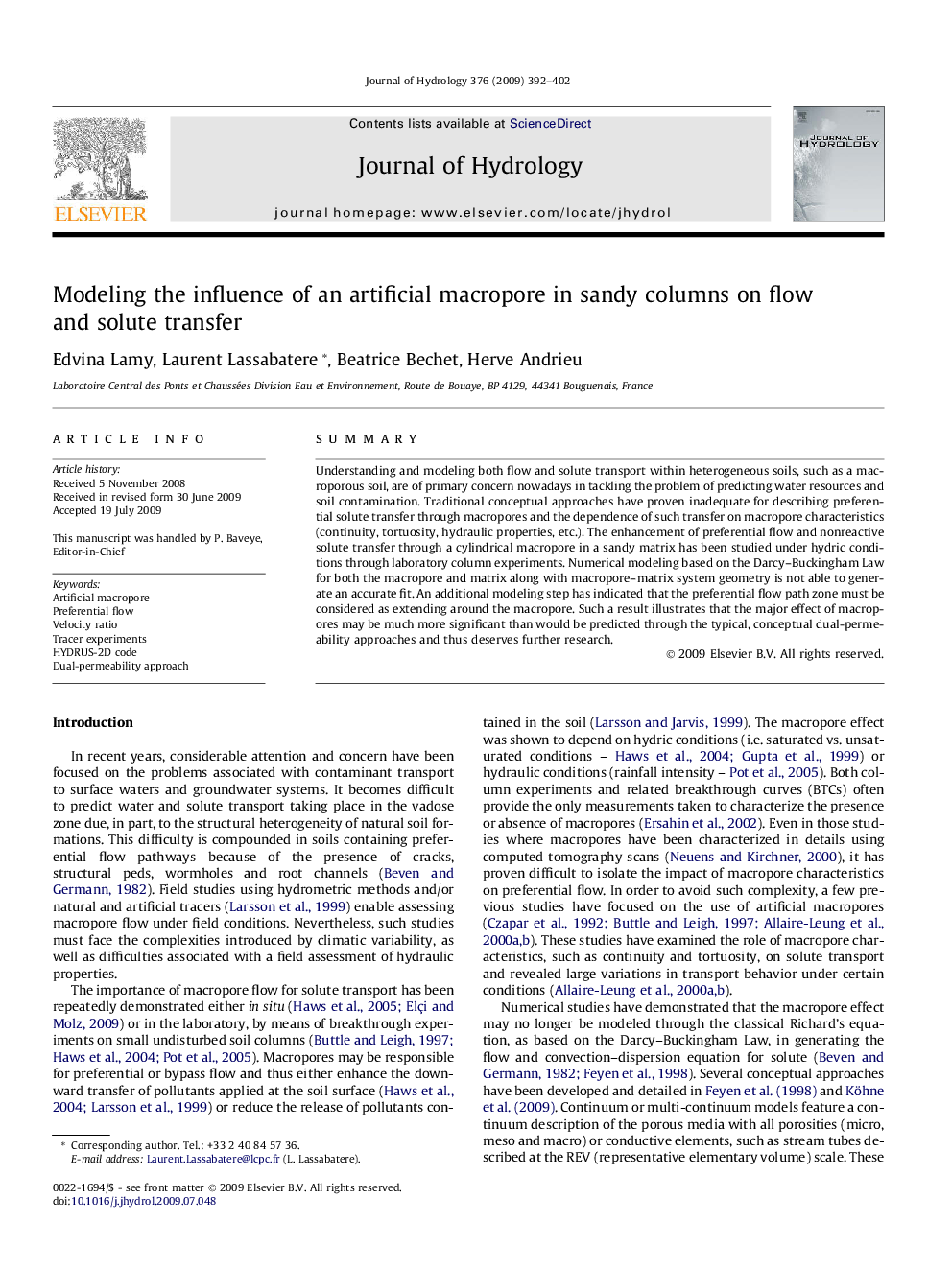 Modeling the influence of an artificial macropore in sandy columns on flow and solute transfer