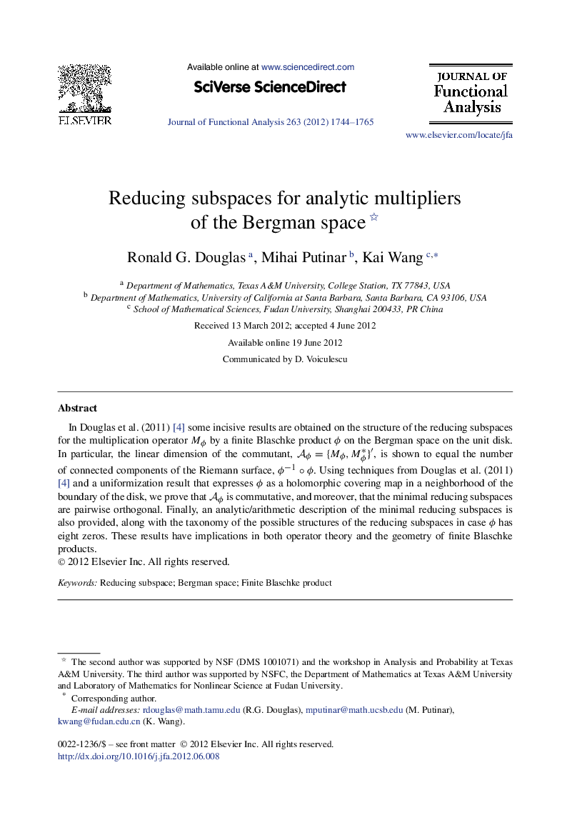 Reducing subspaces for analytic multipliers of the Bergman space 