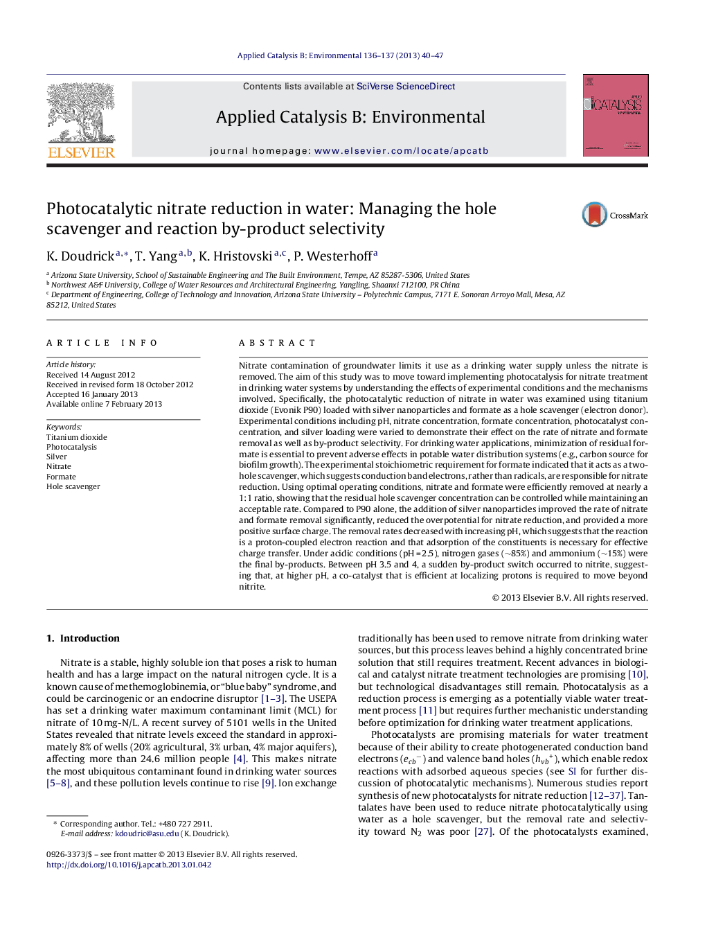 Photocatalytic nitrate reduction in water: Managing the hole scavenger and reaction by-product selectivity