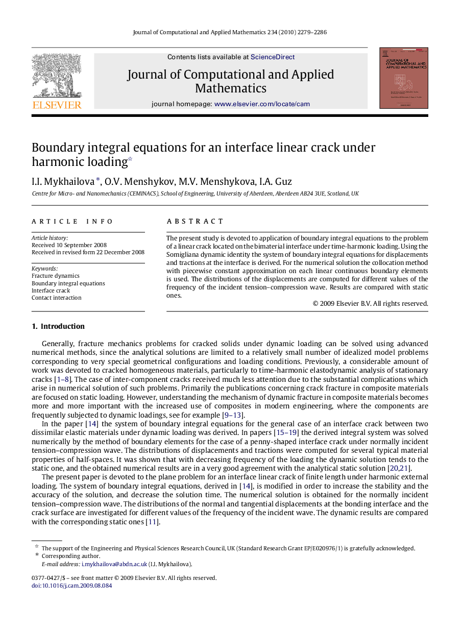 Boundary integral equations for an interface linear crack under harmonic loading 