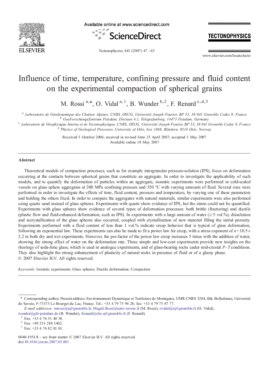 Influence of time, temperature, confining pressure and fluid content on the experimental compaction of spherical grains