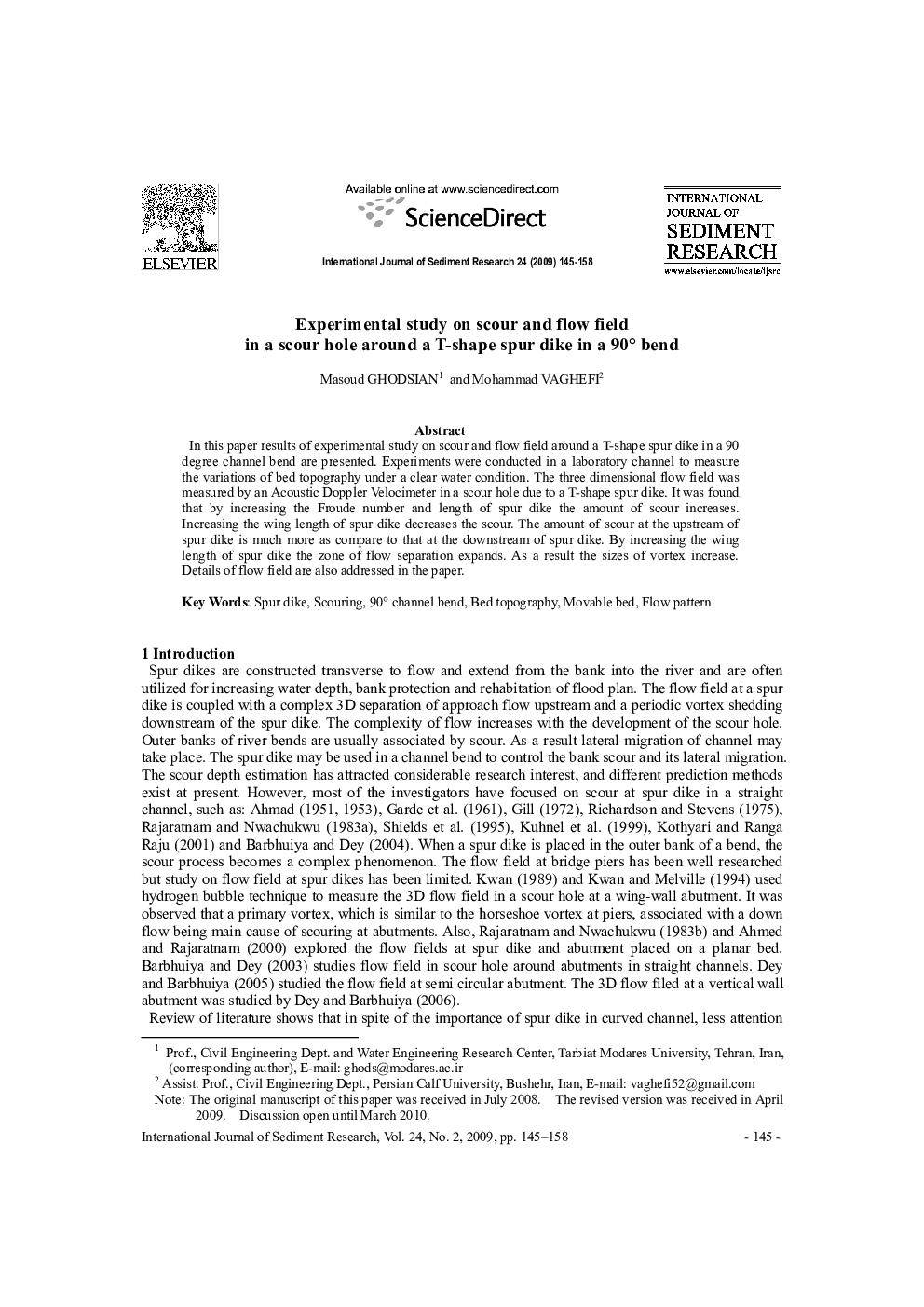 Experimental study on scour and flow field in a scour hole around a T-shape spur dike in a 90° bend 