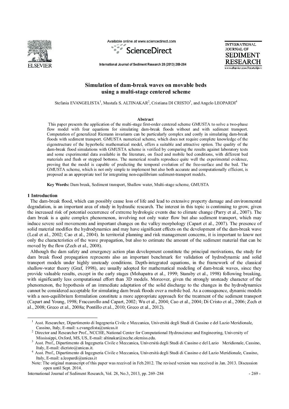 Simulation of dam-break waves on movable beds using a multi-stage centered scheme 