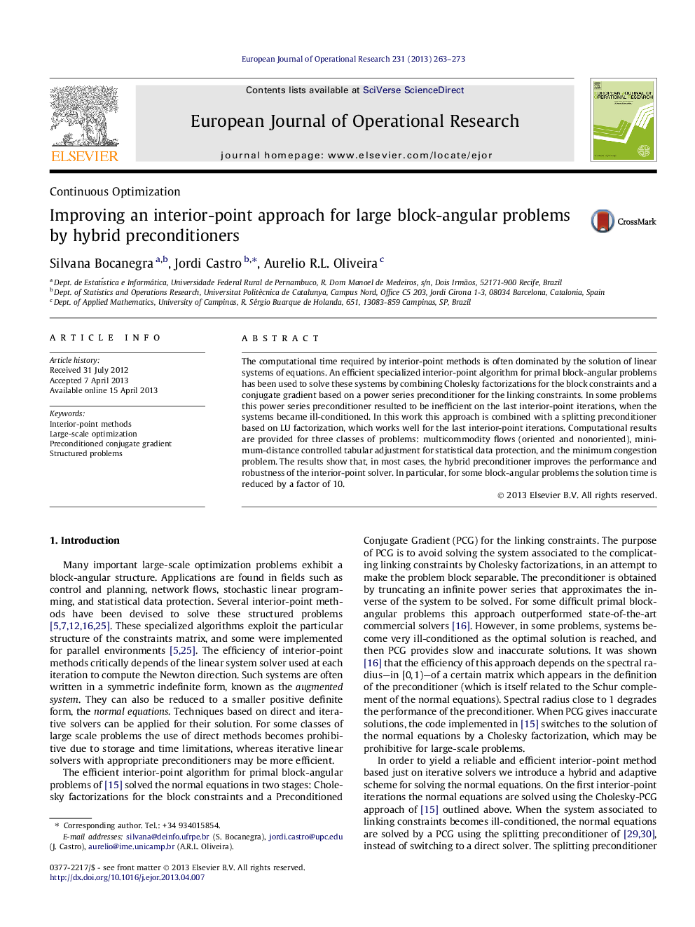 Improving an interior-point approach for large block-angular problems by hybrid preconditioners