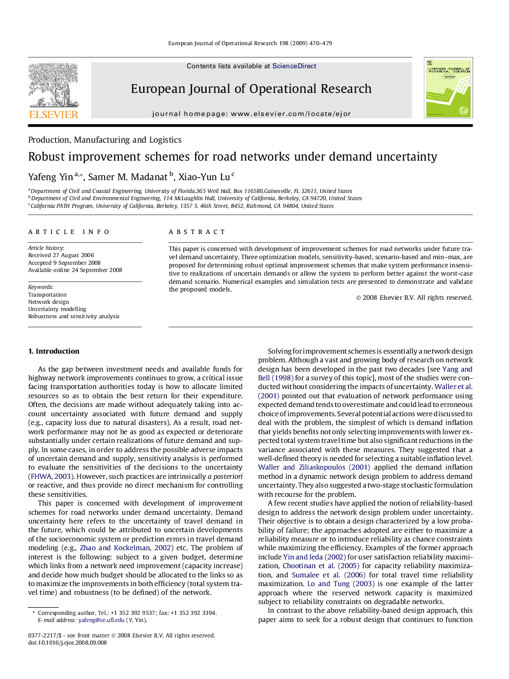 Robust improvement schemes for road networks under demand uncertainty