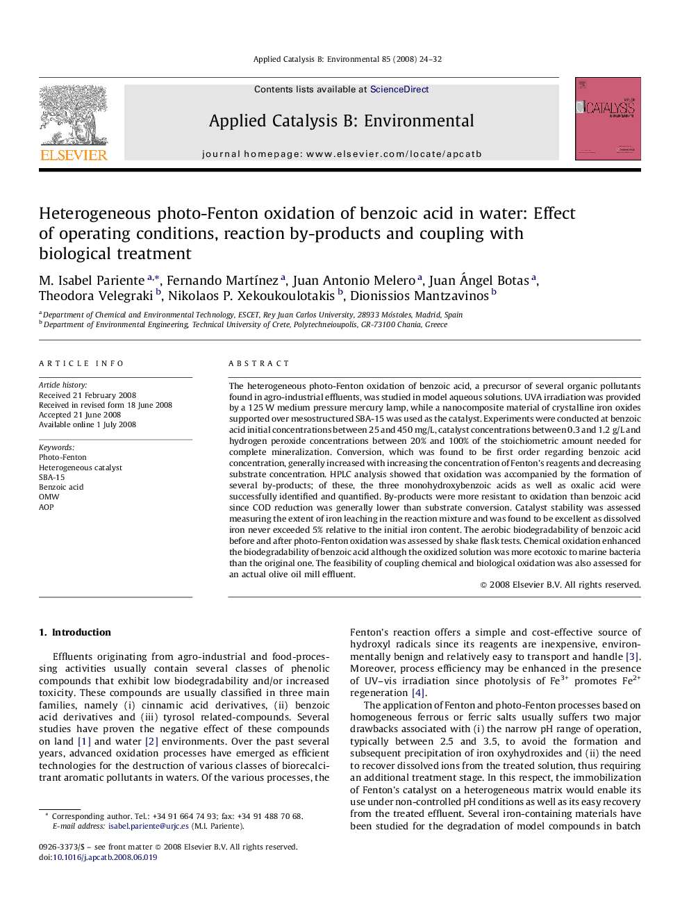 Heterogeneous photo-Fenton oxidation of benzoic acid in water: Effect of operating conditions, reaction by-products and coupling with biological treatment