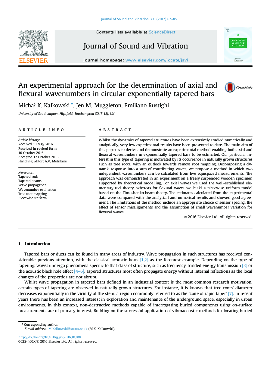 An experimental approach for the determination of axial and flexural wavenumbers in circular exponentially tapered bars