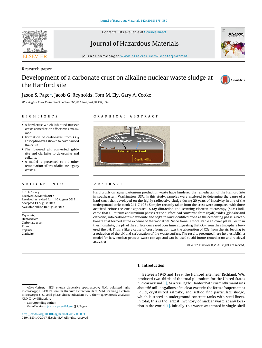 Development of a carbonate crust on alkaline nuclear waste sludge at the Hanford site