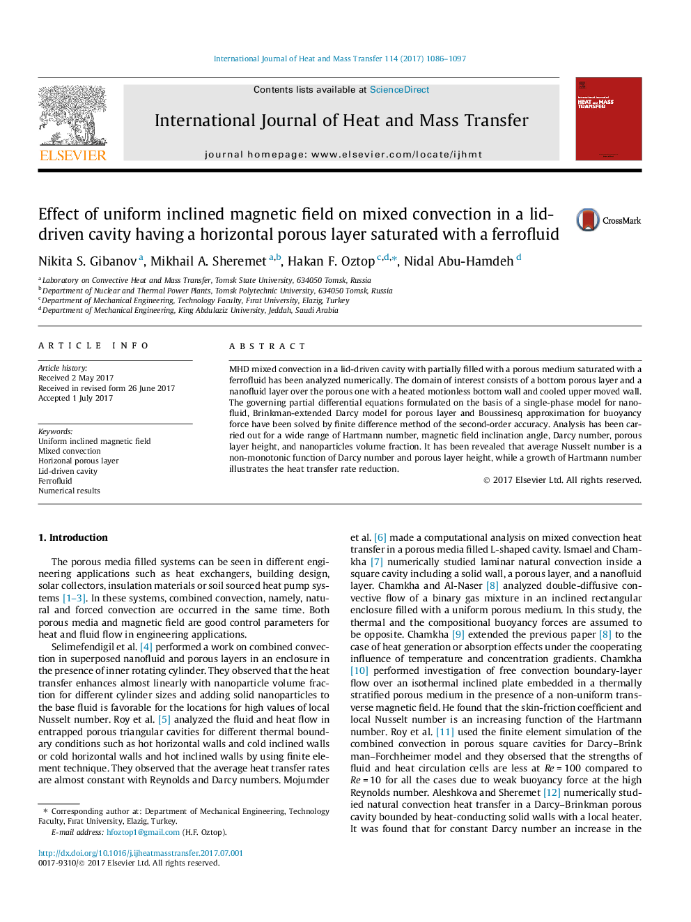 Effect of uniform inclined magnetic field on mixed convection in a lid-driven cavity having a horizontal porous layer saturated with a ferrofluid