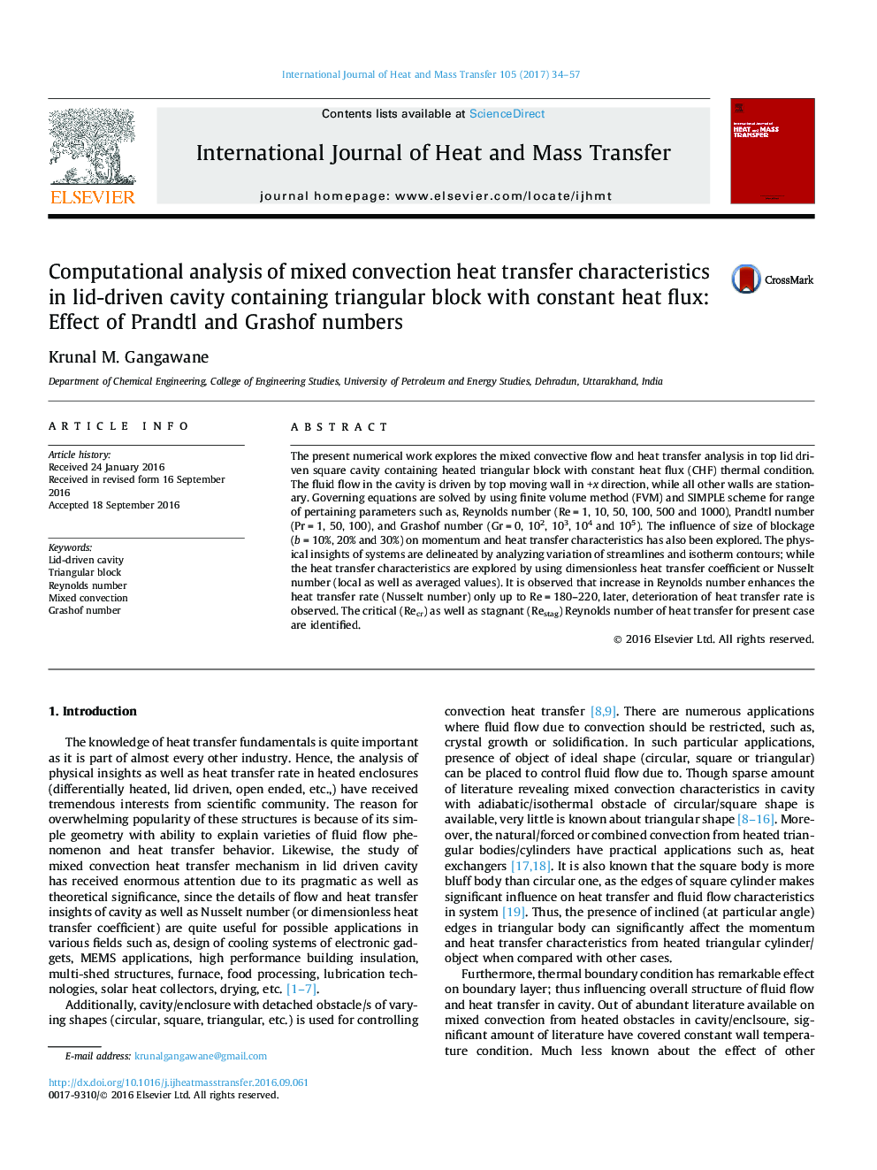 Computational analysis of mixed convection heat transfer characteristics in lid-driven cavity containing triangular block with constant heat flux: Effect of Prandtl and Grashof numbers