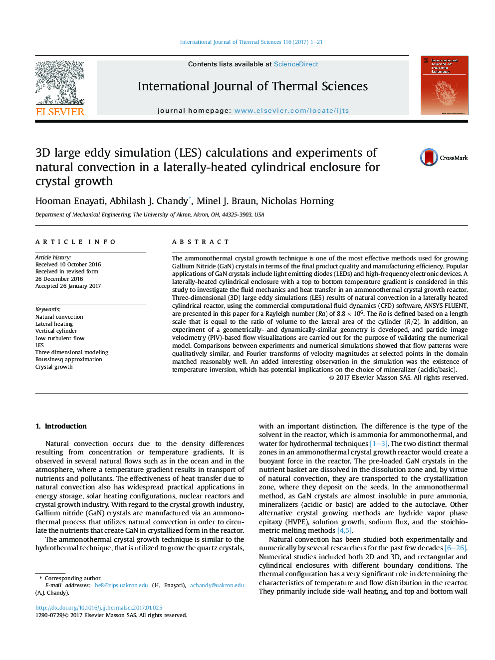 3D large eddy simulation (LES) calculations and experiments of natural convection in a laterally-heated cylindrical enclosure for crystal growth