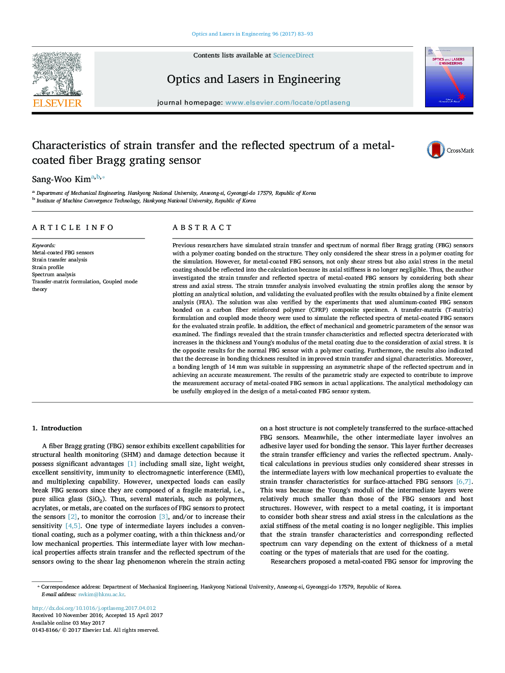 Characteristics of strain transfer and the reflected spectrum of a metal-coated fiber Bragg grating sensor