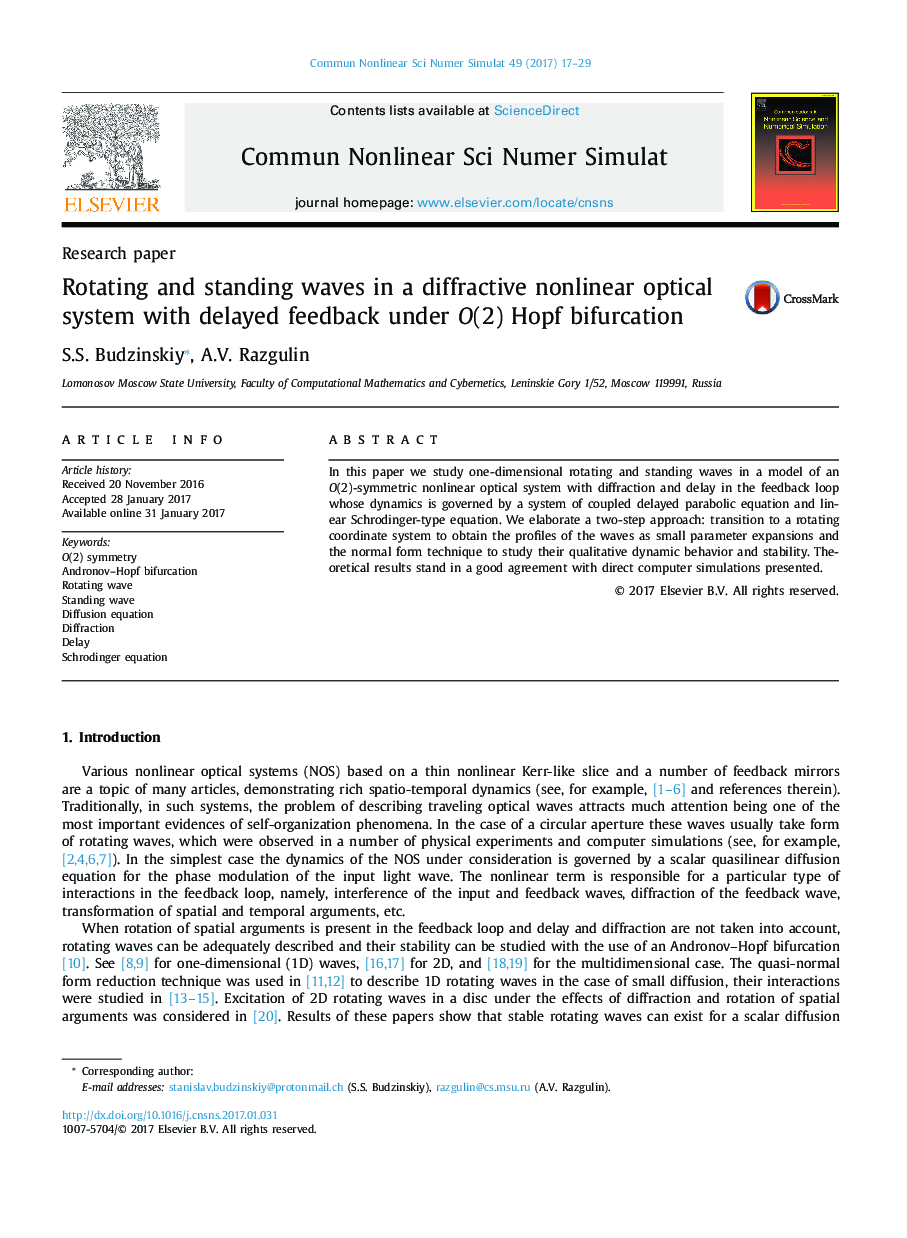 Rotating and standing waves in a diffractive nonlinear optical system with delayed feedback under O(2) Hopf bifurcation