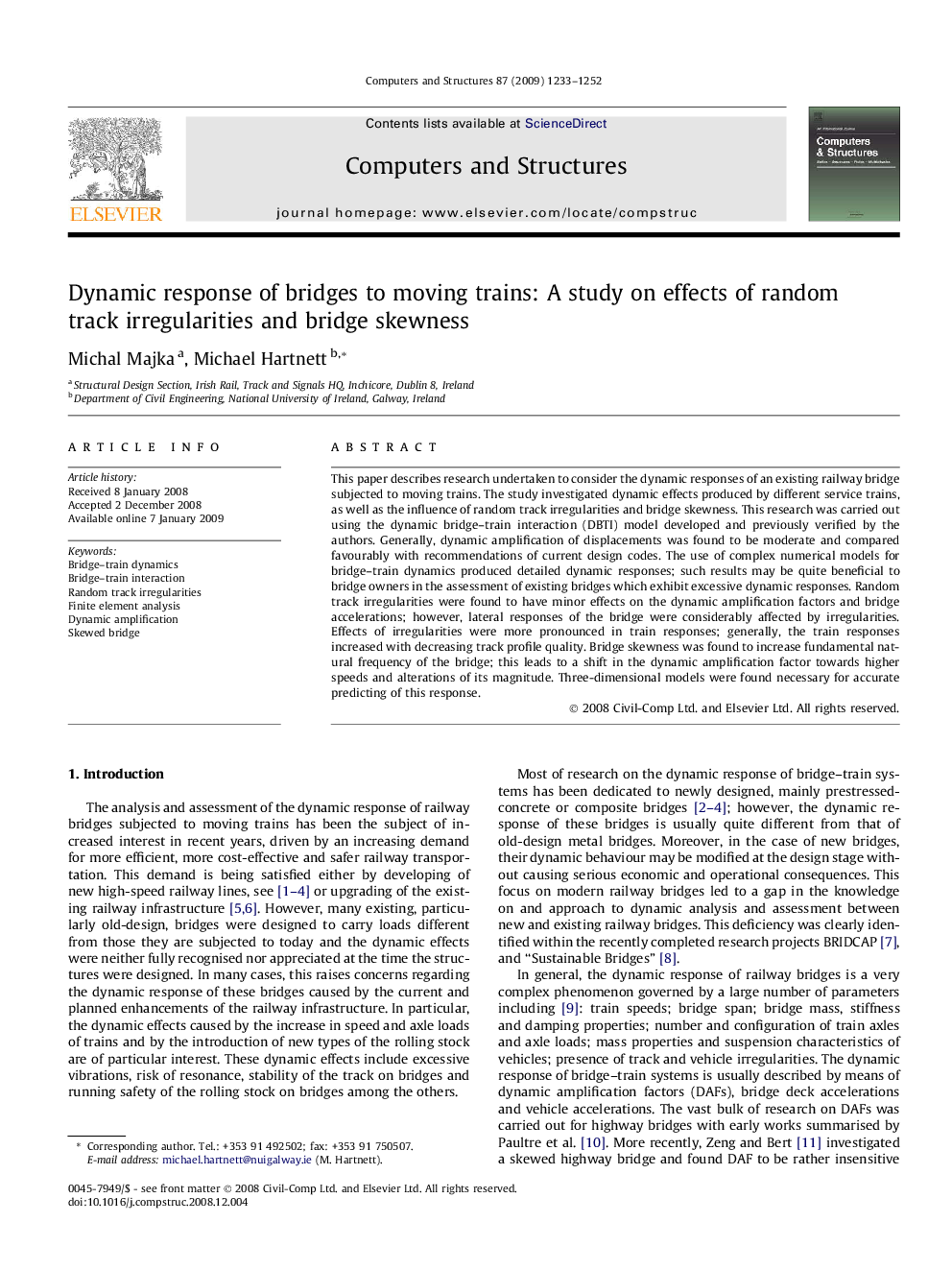 Dynamic response of bridges to moving trains: A study on effects of random track irregularities and bridge skewness