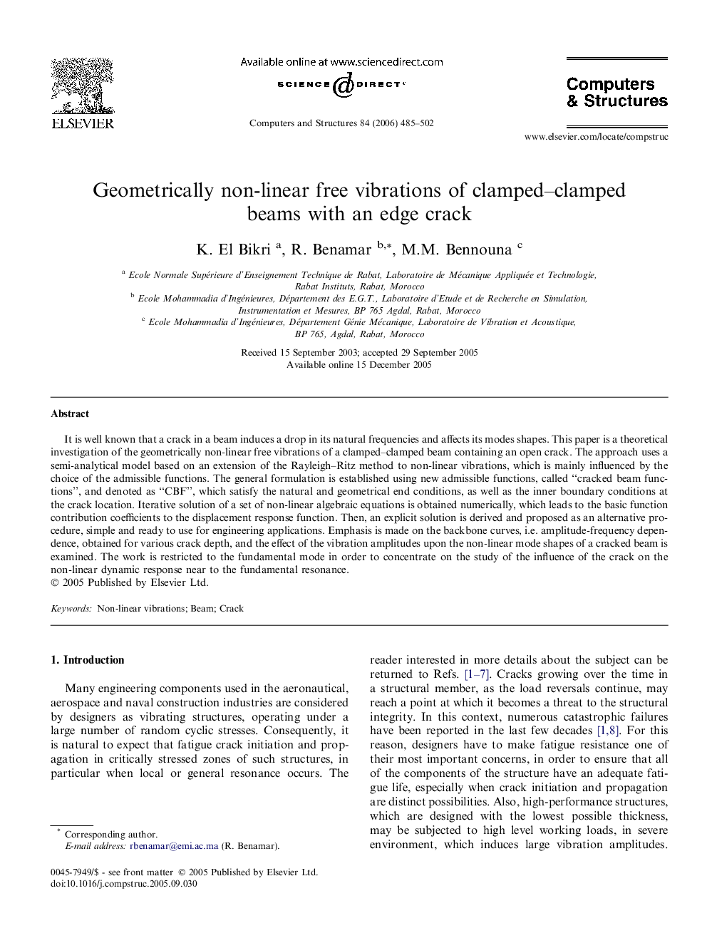 Geometrically non-linear free vibrations of clamped–clamped beams with an edge crack