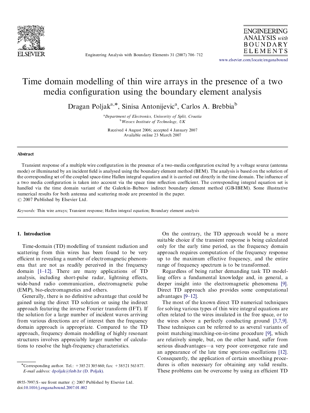 Time domain modelling of thin wire arrays in the presence of a two media configuration using the boundary element analysis