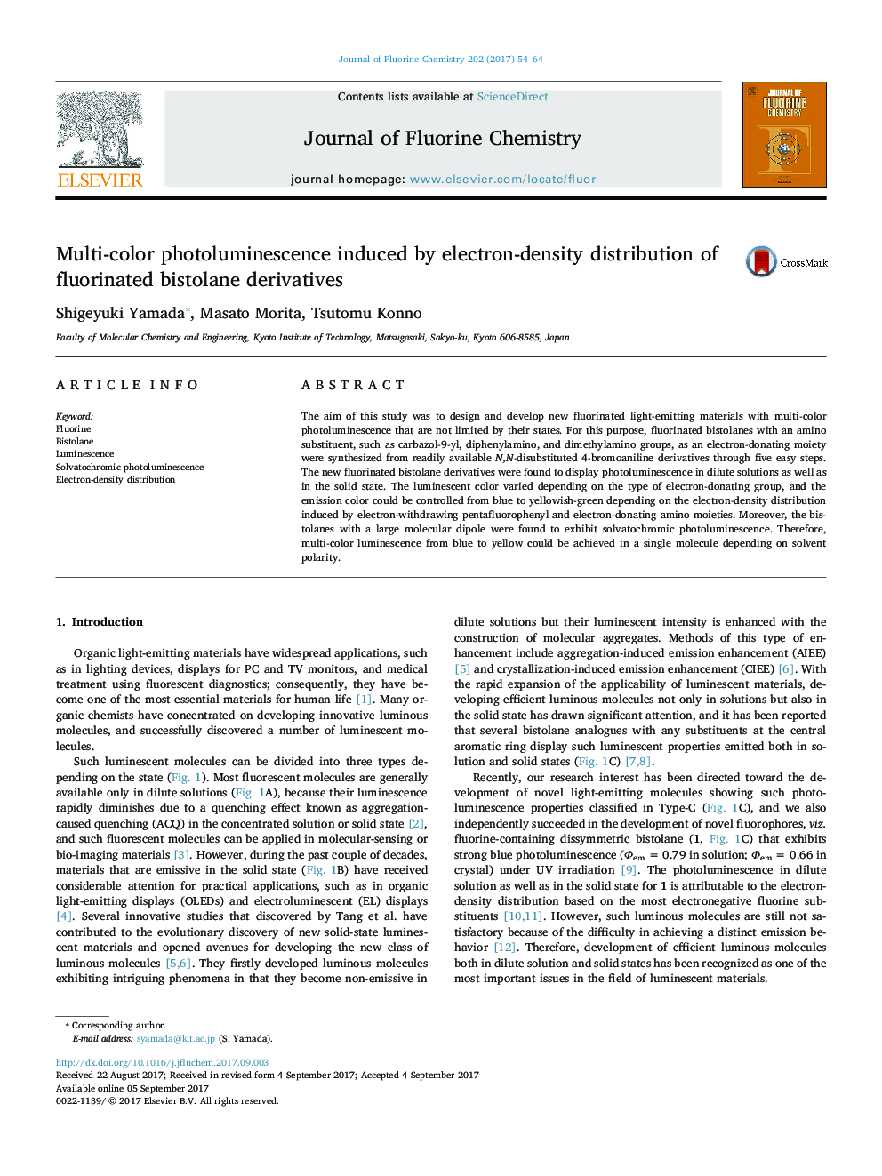 Multi-color photoluminescence induced by electron-density distribution of fluorinated bistolane derivatives