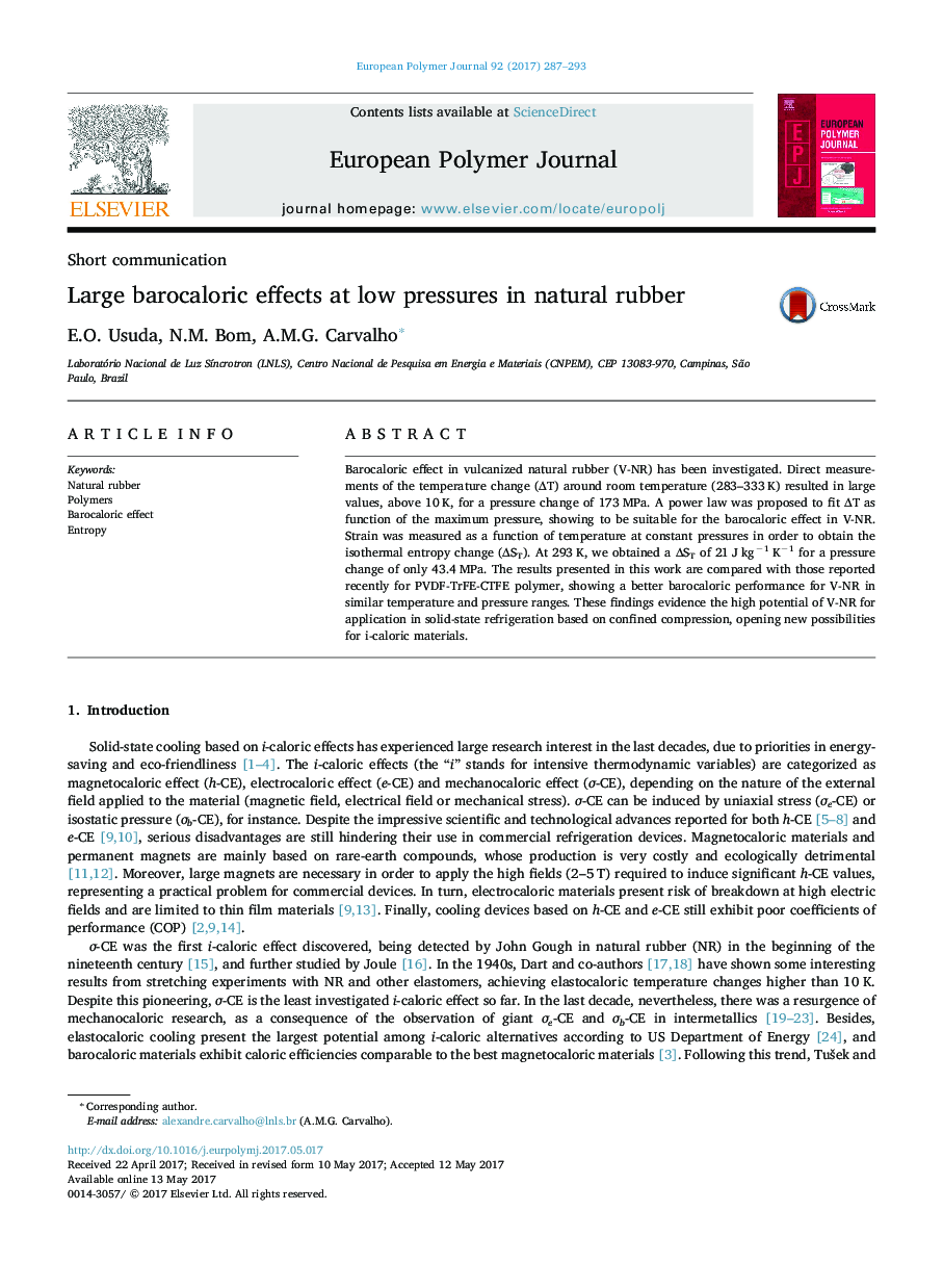 Large barocaloric effects at low pressures in natural rubber