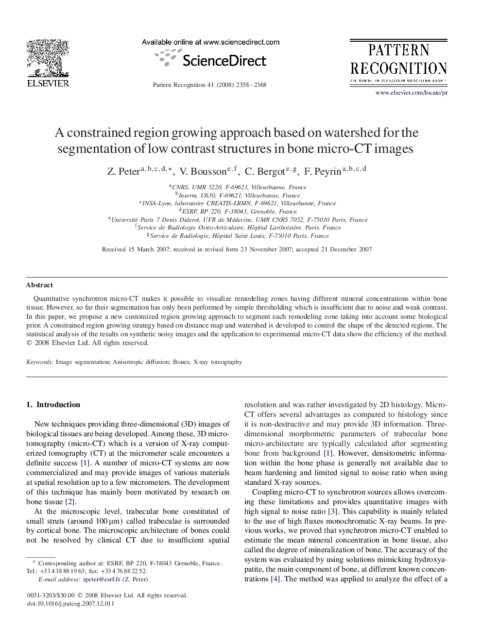 A constrained region growing approach based on watershed for the segmentation of low contrast structures in bone micro-CT images