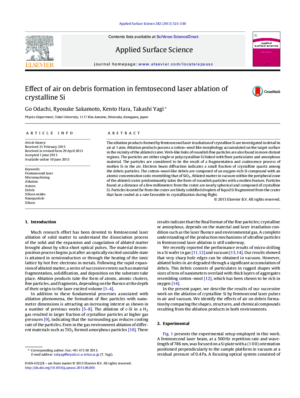 Effect of air on debris formation in femtosecond laser ablation of crystalline Si