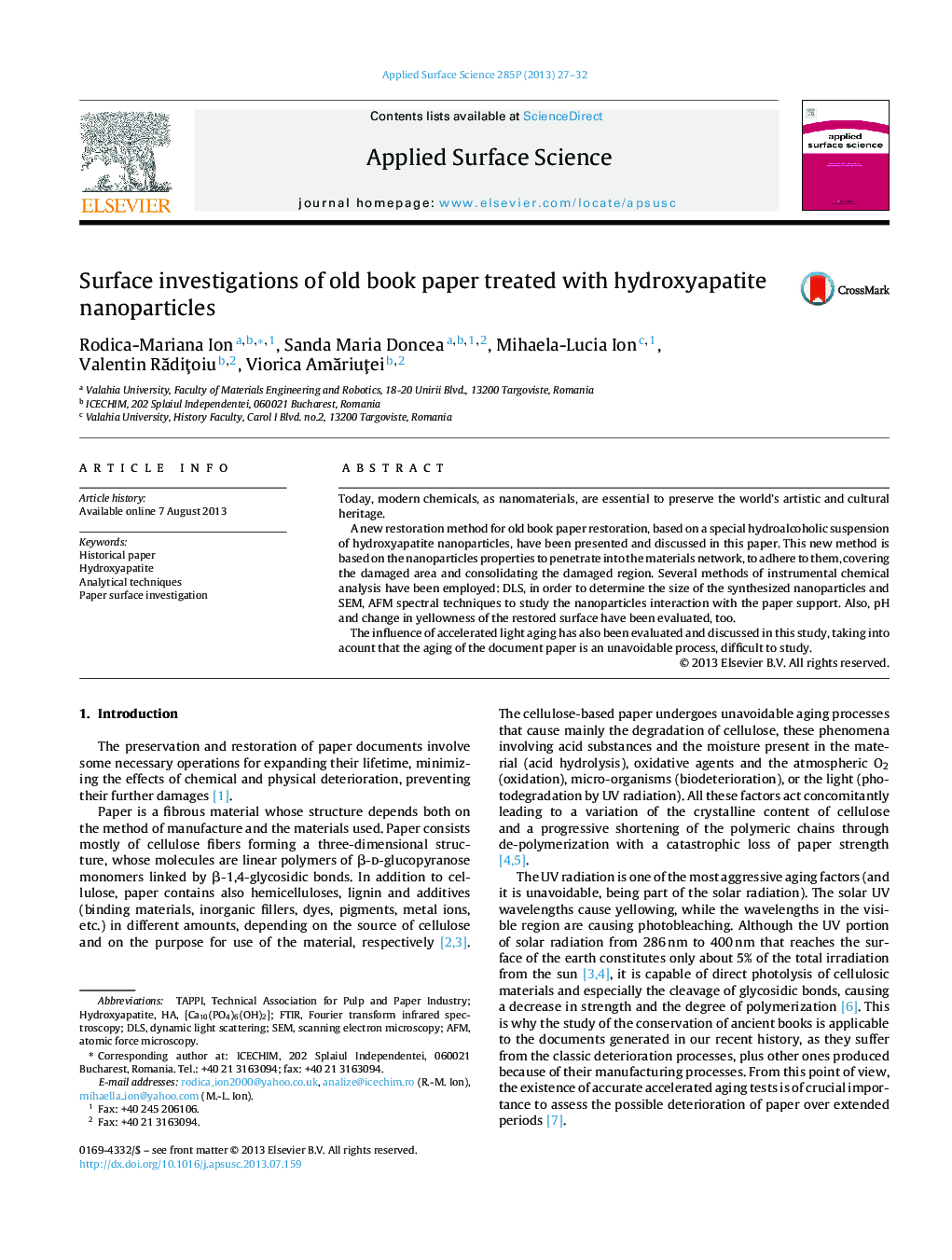 Surface investigations of old book paper treated with hydroxyapatite nanoparticles