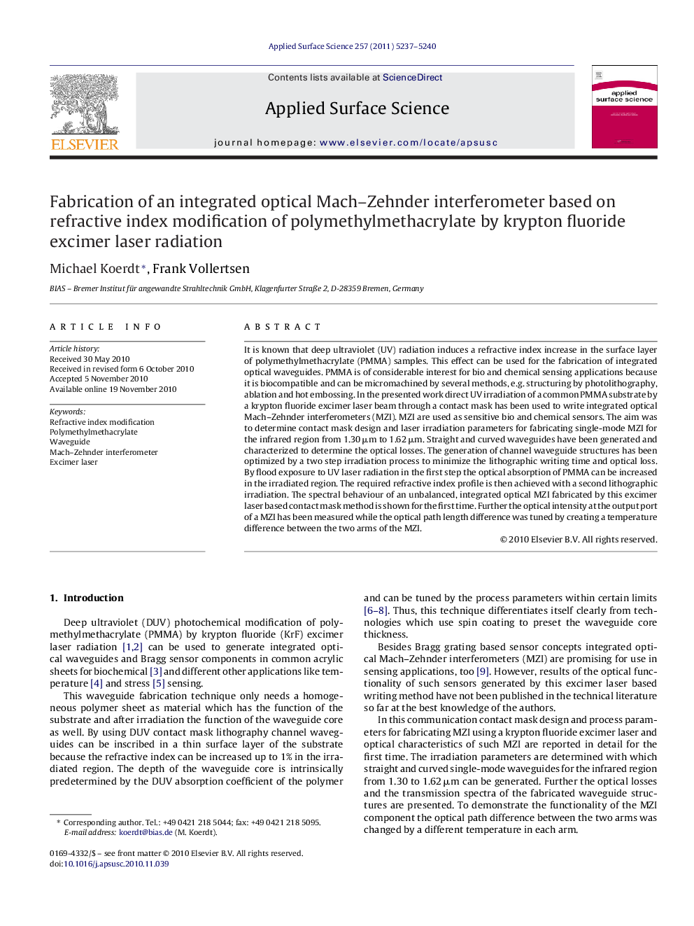 Fabrication of an integrated optical Mach-Zehnder interferometer based on refractive index modification of polymethylmethacrylate by krypton fluoride excimer laser radiation