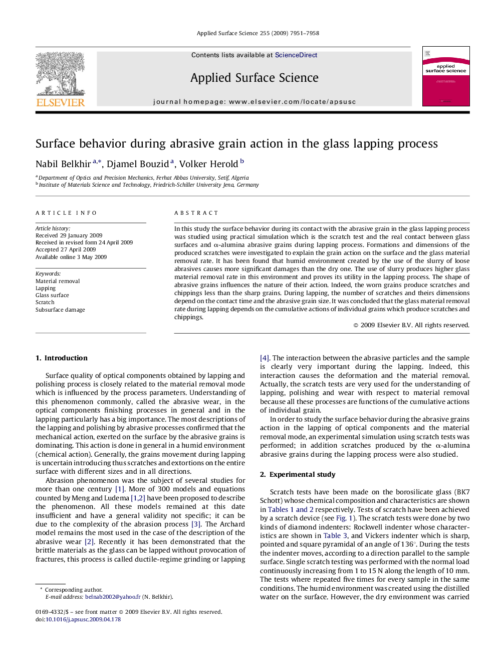 Surface behavior during abrasive grain action in the glass lapping process