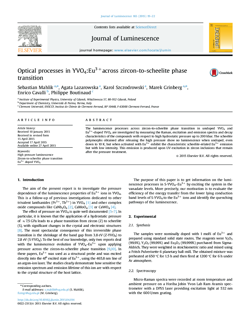 Optical processes in YVO4:Eu3+across zircon-to-scheelite phase transition