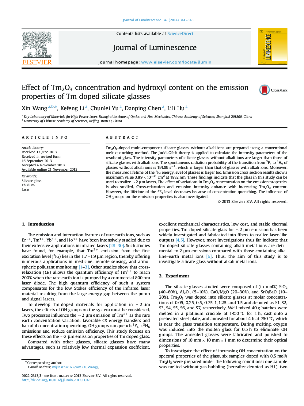 Effect of Tm2O3 concentration and hydroxyl content on the emission properties of Tm doped silicate glasses