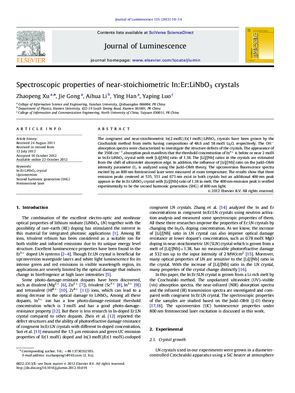 Spectroscopic properties of near-stoichiometric In:Er:LiNbO3 crystals